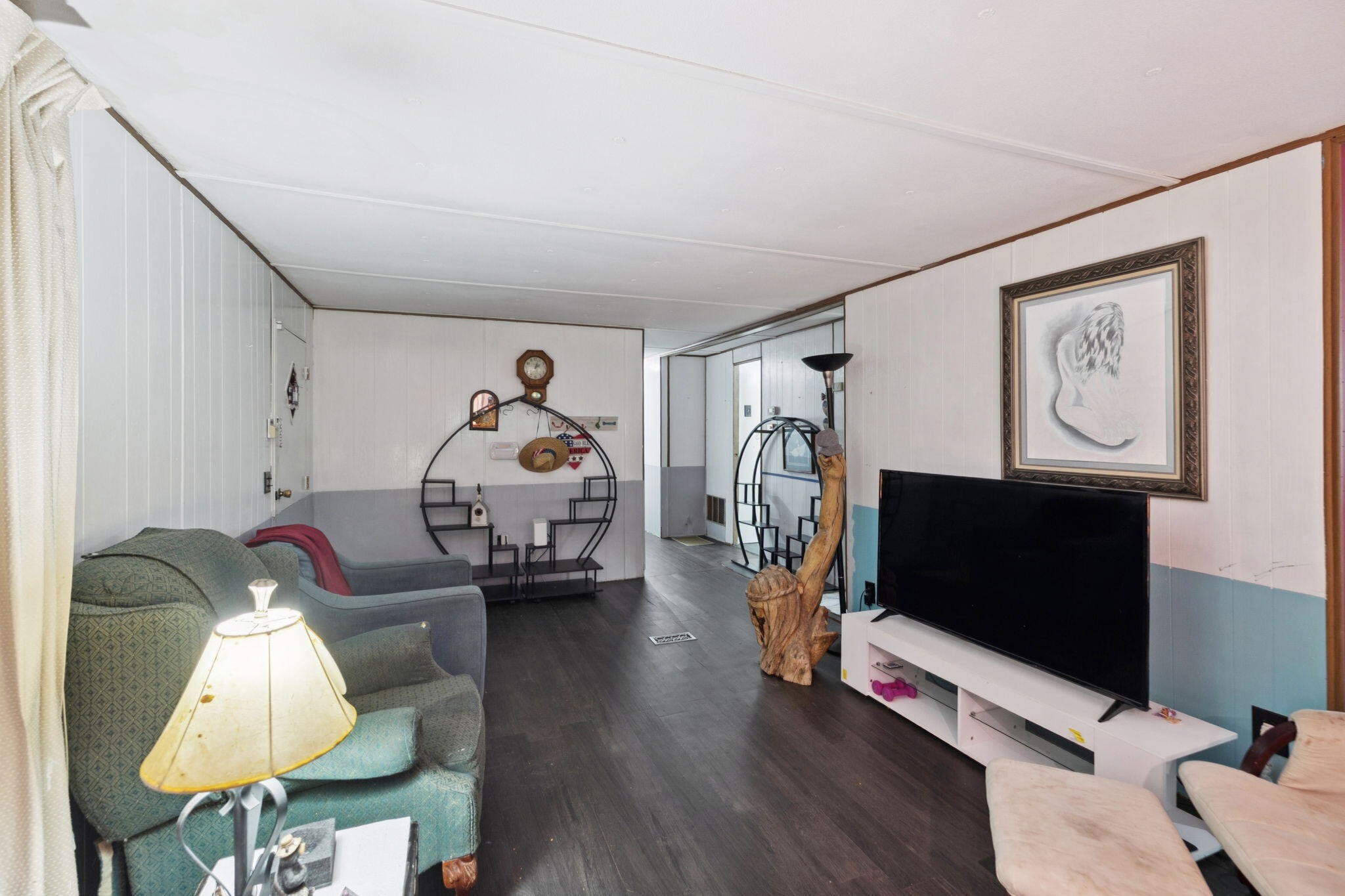 7503 Davis Mill Road Harrison, TN 37341 - Photo 12 of 33 a living room with furniture a flat screen tv and a fireplace