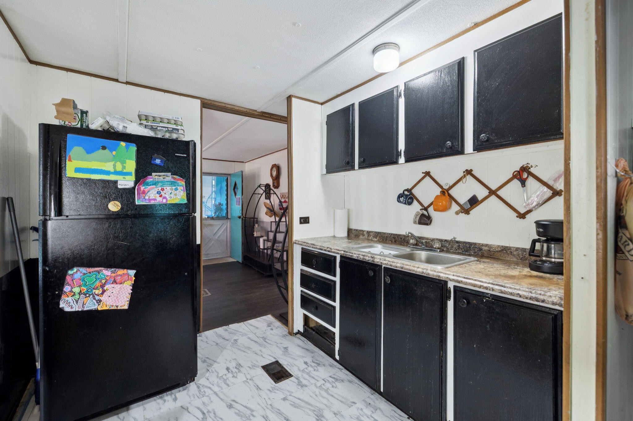 7503 Davis Mill Road Harrison, TN 37341 - Photo 18 of 33 a kitchen with stainless steel appliances kitchen island granite countertop a refrigerator and stove