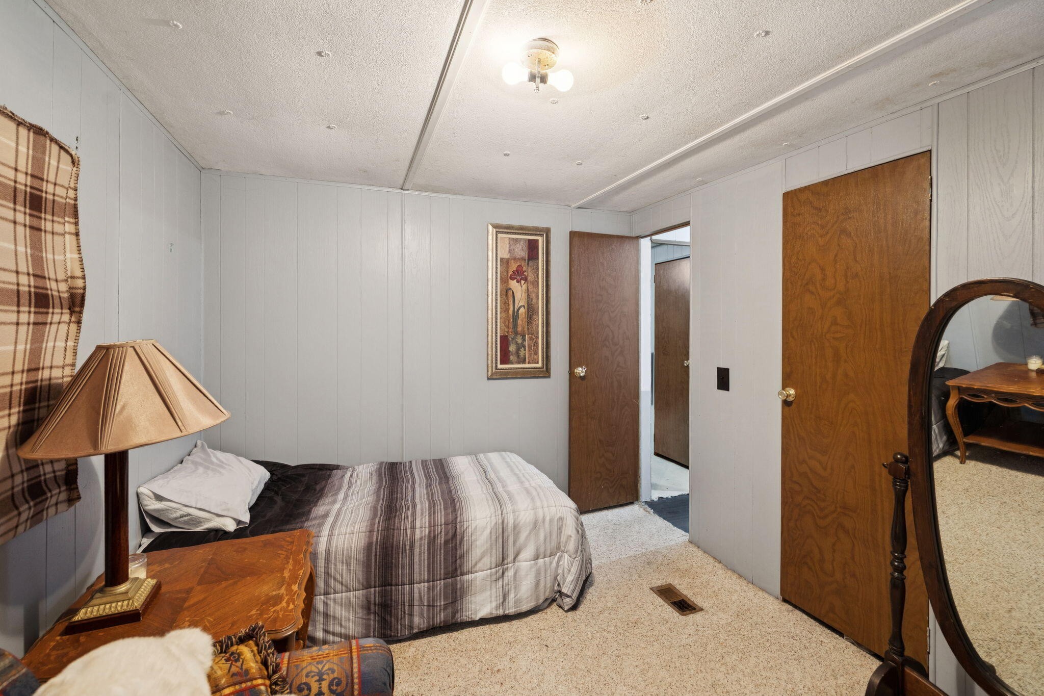 7503 Davis Mill Road Harrison, TN 37341 - Photo 21 of 33 a bedroom with a bed and a mirror