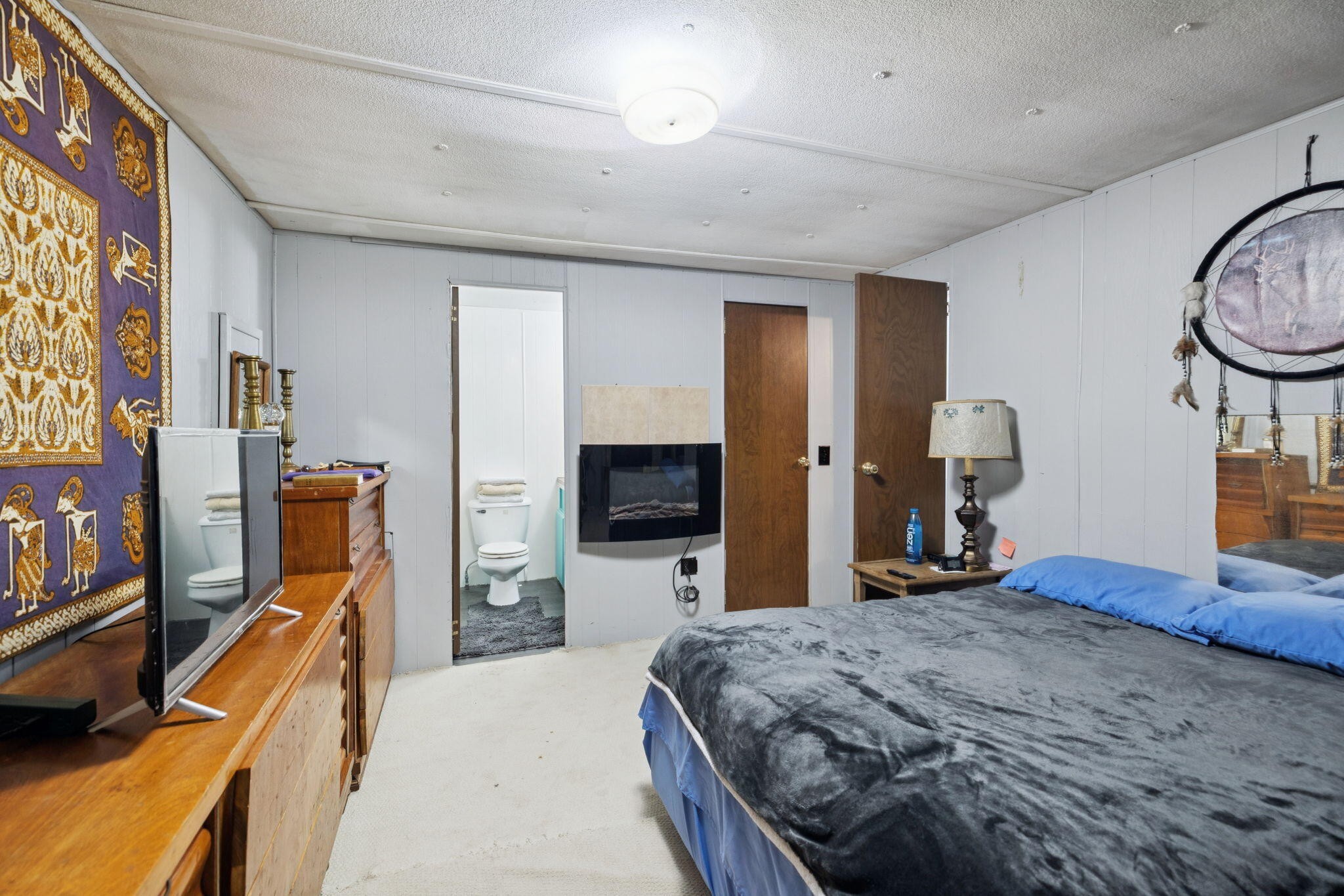 7503 Davis Mill Road Harrison, TN 37341 - Photo 23 of 33 a bedroom with a bed and a flat tv screen on dresser