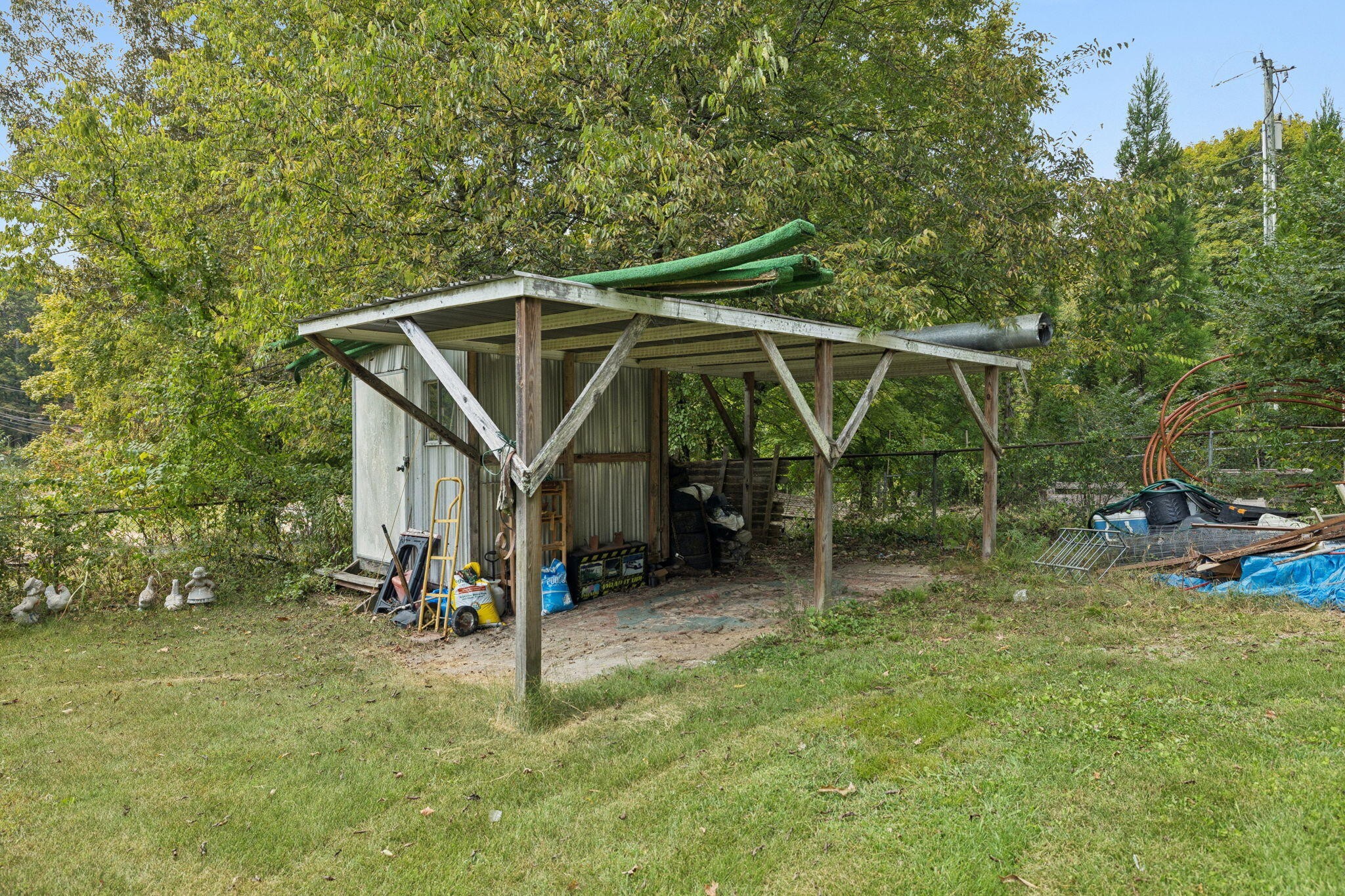 7503 Davis Mill Road Harrison, TN 37341 - Photo 32 of 33 a view of a chair and table in backyard of the house