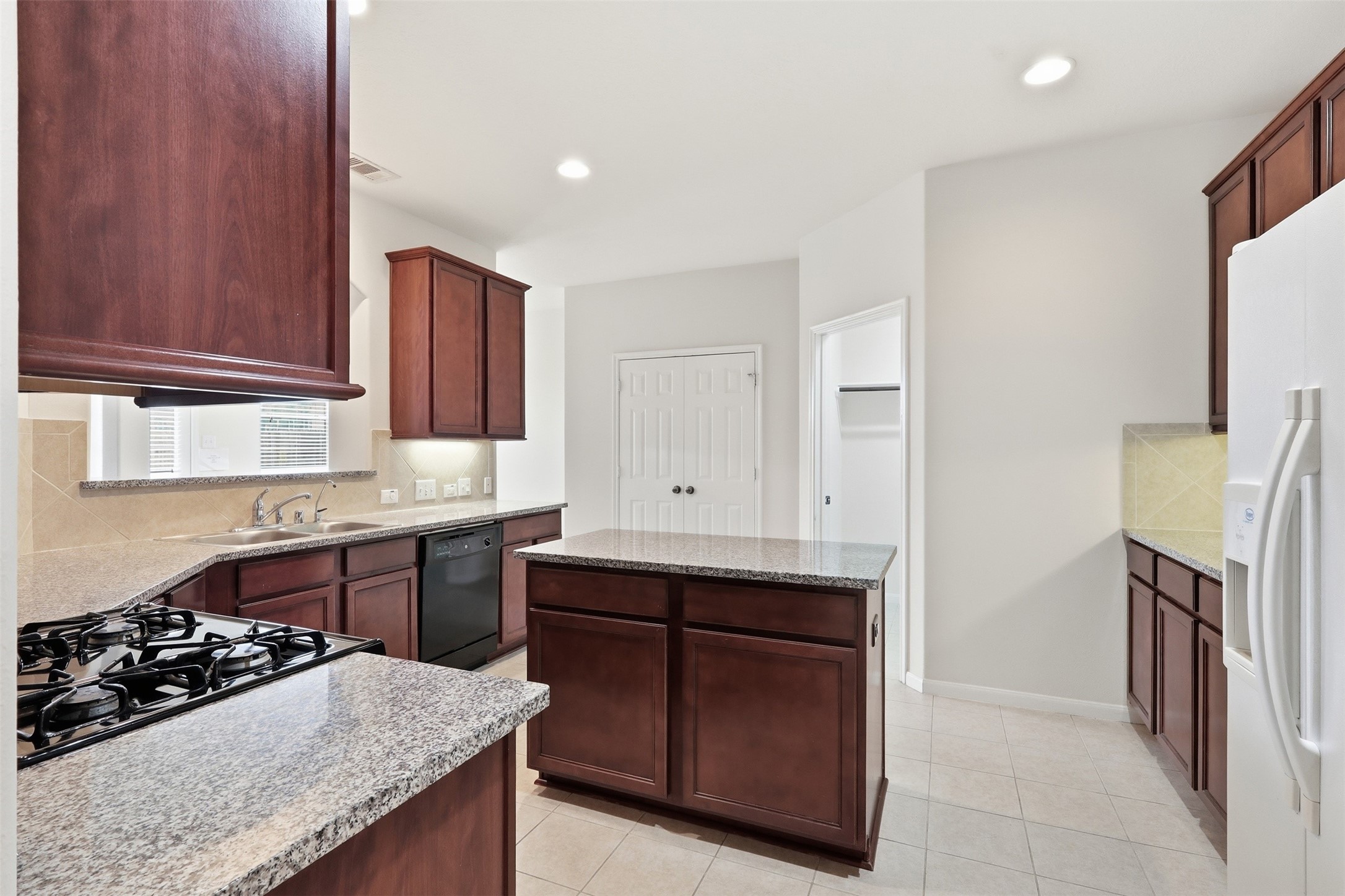 1911 Vale Brook Drive Spring, TX 77373 - Photo 6 of 27 An open-concept layout allows the kitchen to seamlessly connect with the main living spaces, making entertaining effortless.