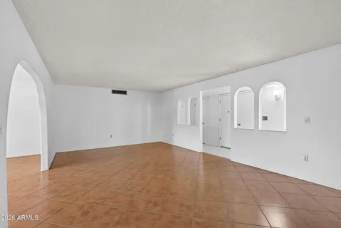a view of empty room with closet