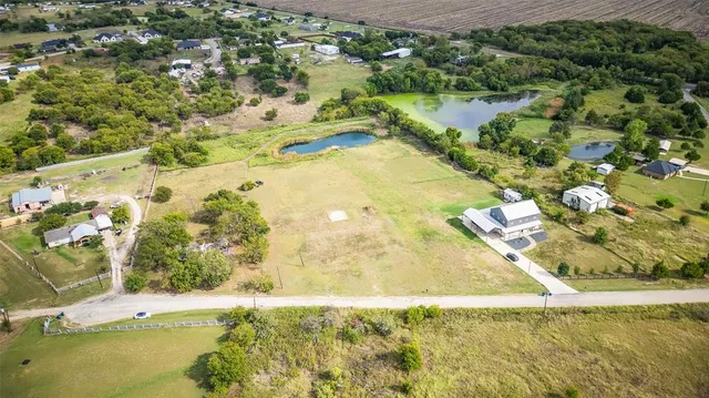 a view of a swimming pool with a table and chairs