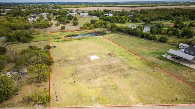 a view of a lake with big yard