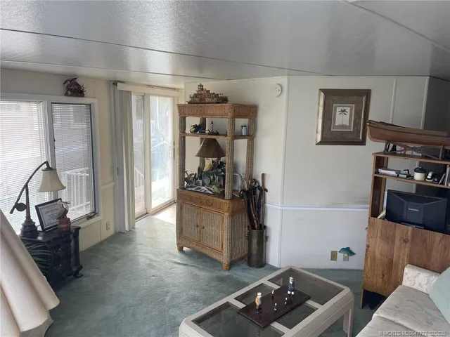 a view of livingroom with furniture and workspace