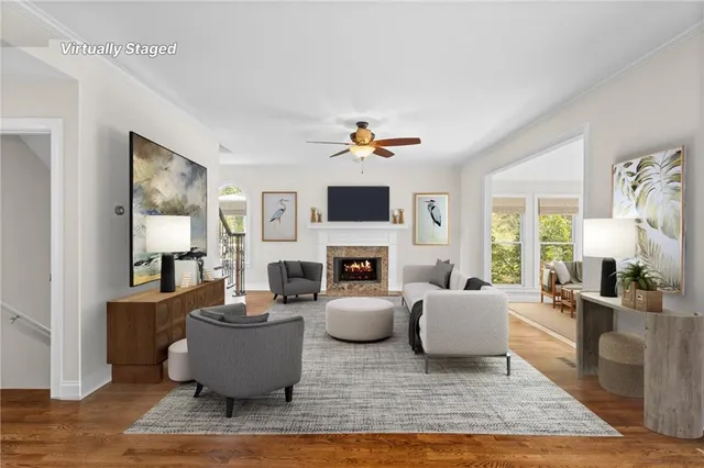 a living room with fireplace furniture and a flat screen tv