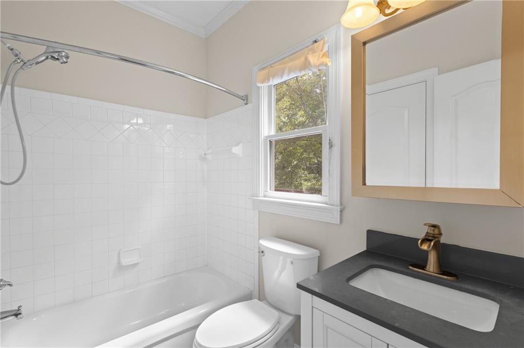 3685 Rolling Creek Drive Northeast Buford, GA 30519 - Photo 29 of 48 a bathroom with a sink toilet and shower