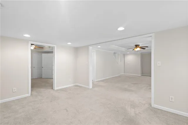an empty room with closet and natural light