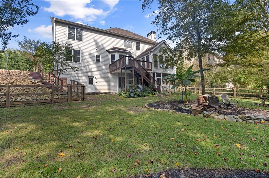 3685 Rolling Creek Drive Northeast Buford, GA 30519 - Photo 40 of 48 a view of a house with a yard