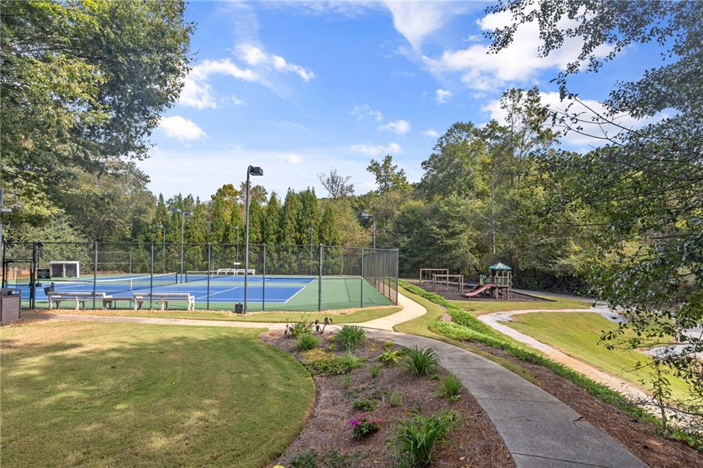 3685 Rolling Creek Drive Northeast Buford, GA 30519 - Photo 44 of 48 a view of a swimming pool with a patio and a yard