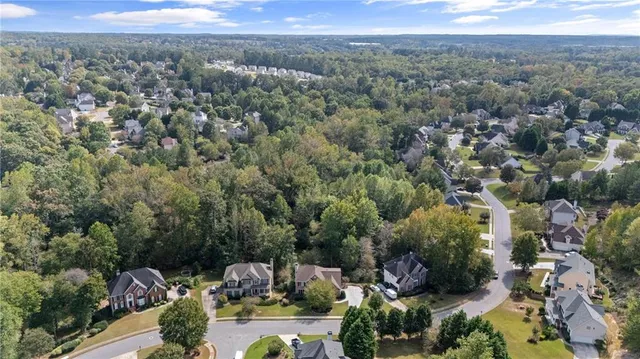 an aerial view of a houses with city view