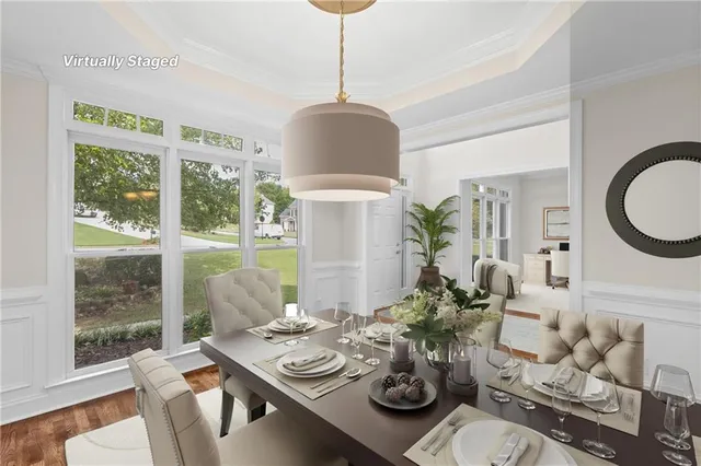 a view of a dining room with furniture window and wooden floor