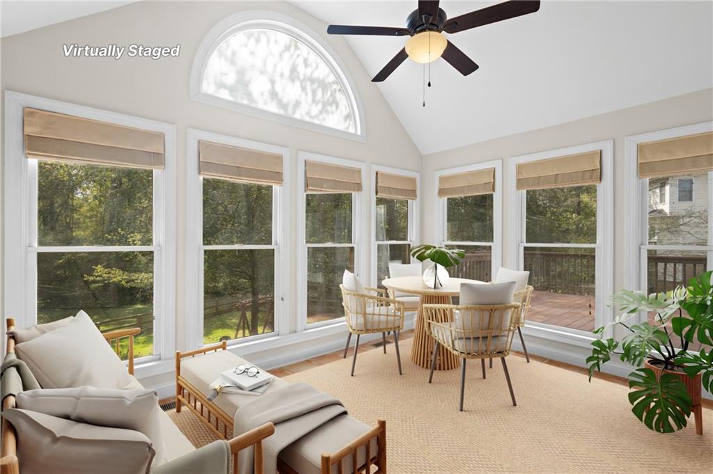3685 Rolling Creek Drive Northeast Buford, GA 30519 - Photo 6 of 48 a dining room with furniture a chandelier and a rug