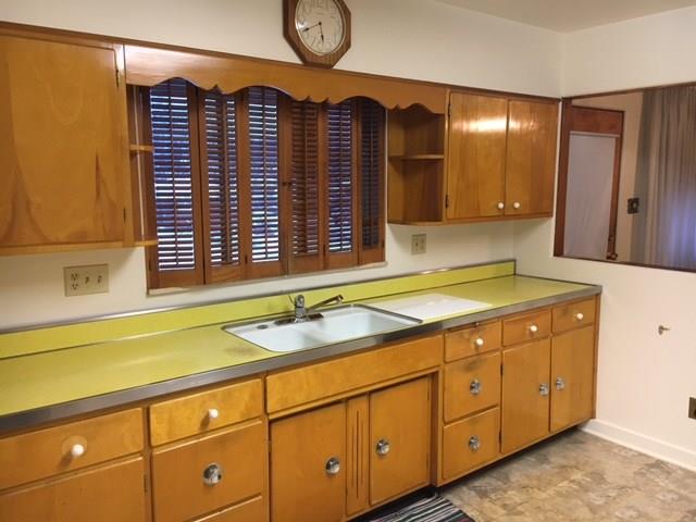 1125 State Road Monessen, PA 15062 - Photo 7 of 25 Eat-in-Kitchen with Wooden Cabinets and Pass Through to the Dining Room.