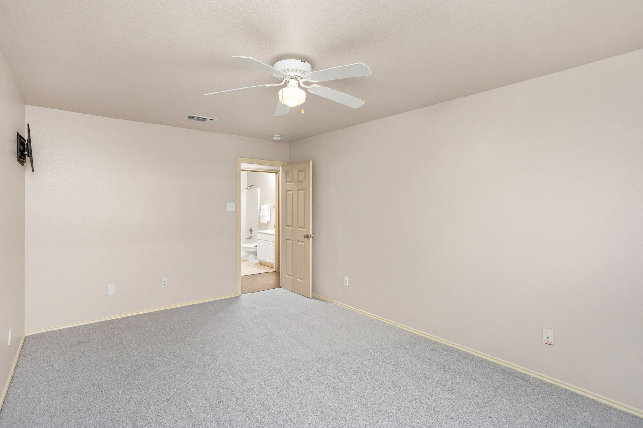 409 Lydia Lane Thrall, TX 76578 - Photo 19 of 25 a view of an empty room with a chandelier fan