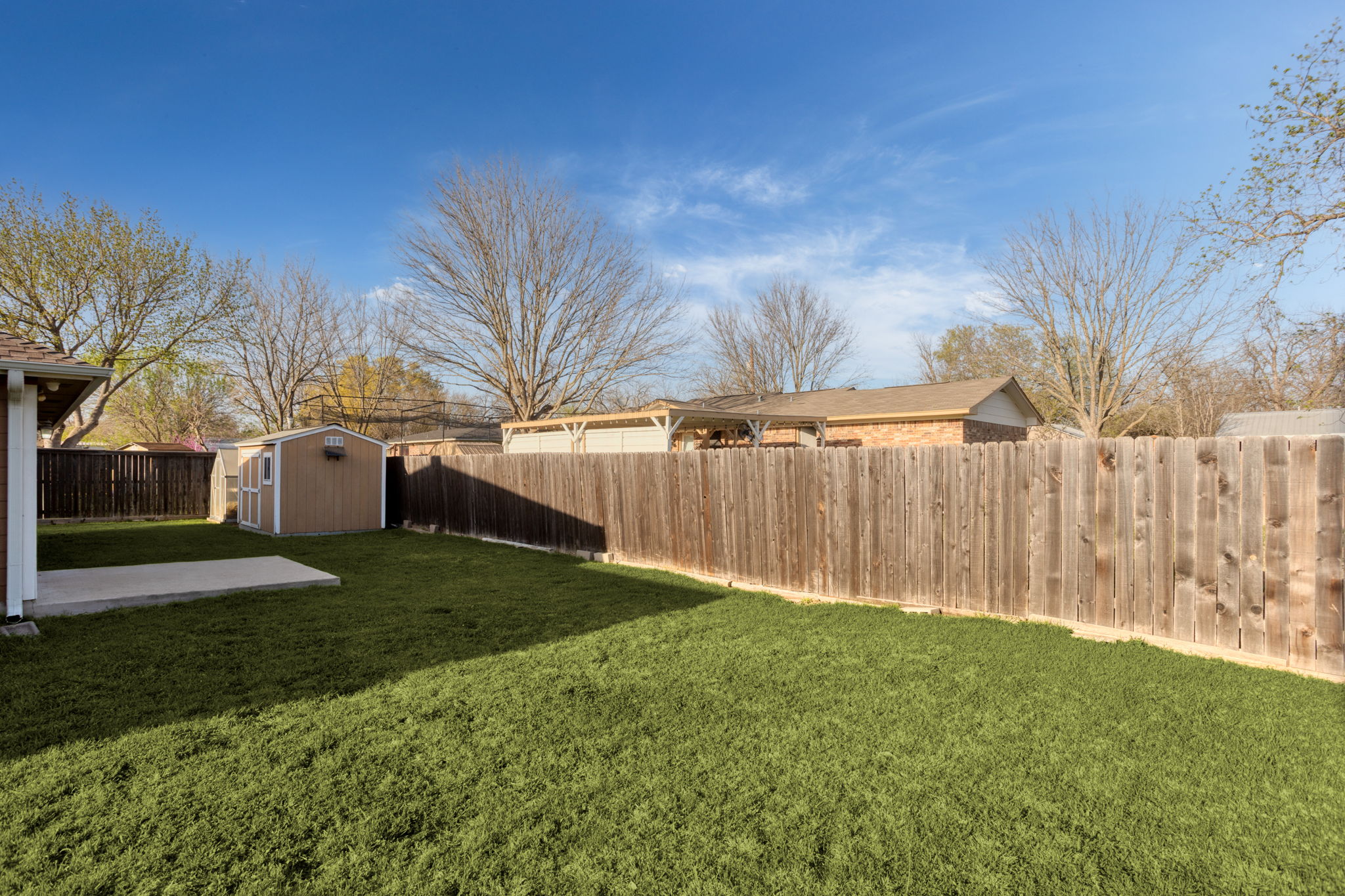 409 Lydia Lane Thrall, TX 76578 - Photo 23 of 25 a backyard of a house with lots of green space