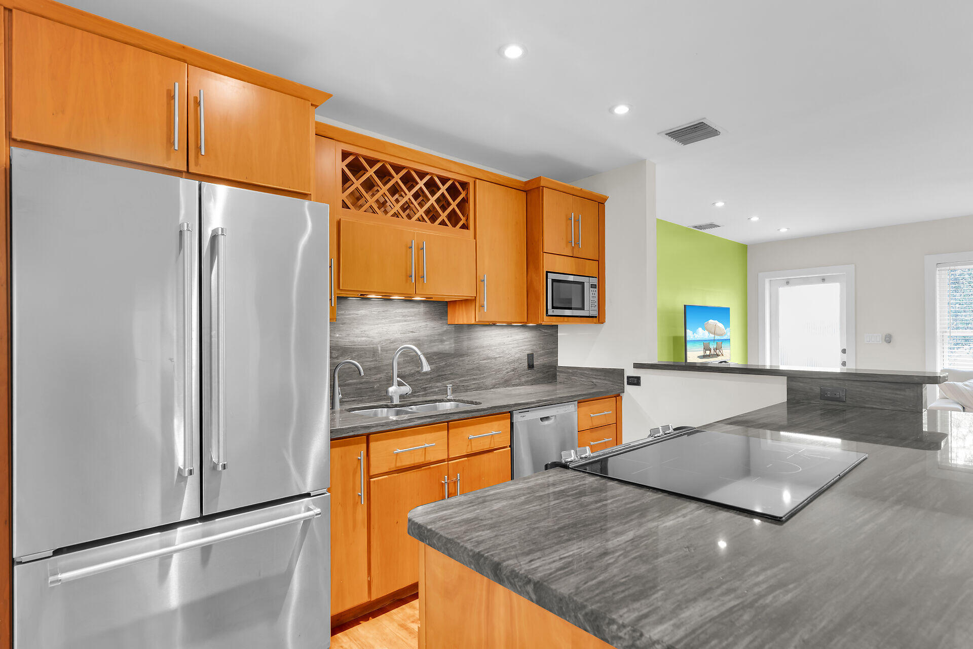 3707 Paula Avenue Key West, FL 33040 - Photo 11 of 26 a kitchen with stainless steel appliances granite countertop a refrigerator a sink and a stove