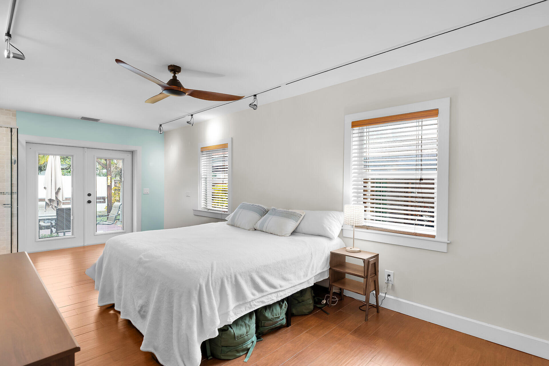 3707 Paula Avenue Key West, FL 33040 - Photo 13 of 26 a bedroom with a bed a dresser and a window