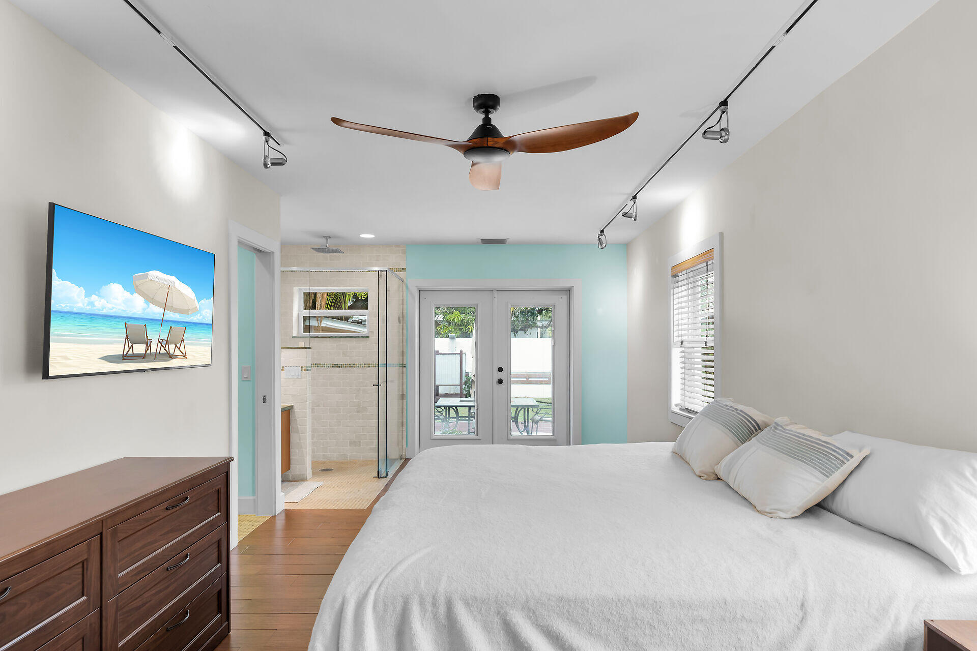 3707 Paula Avenue Key West, FL 33040 - Photo 14 of 26 a bedroom with a large bed and a dresser