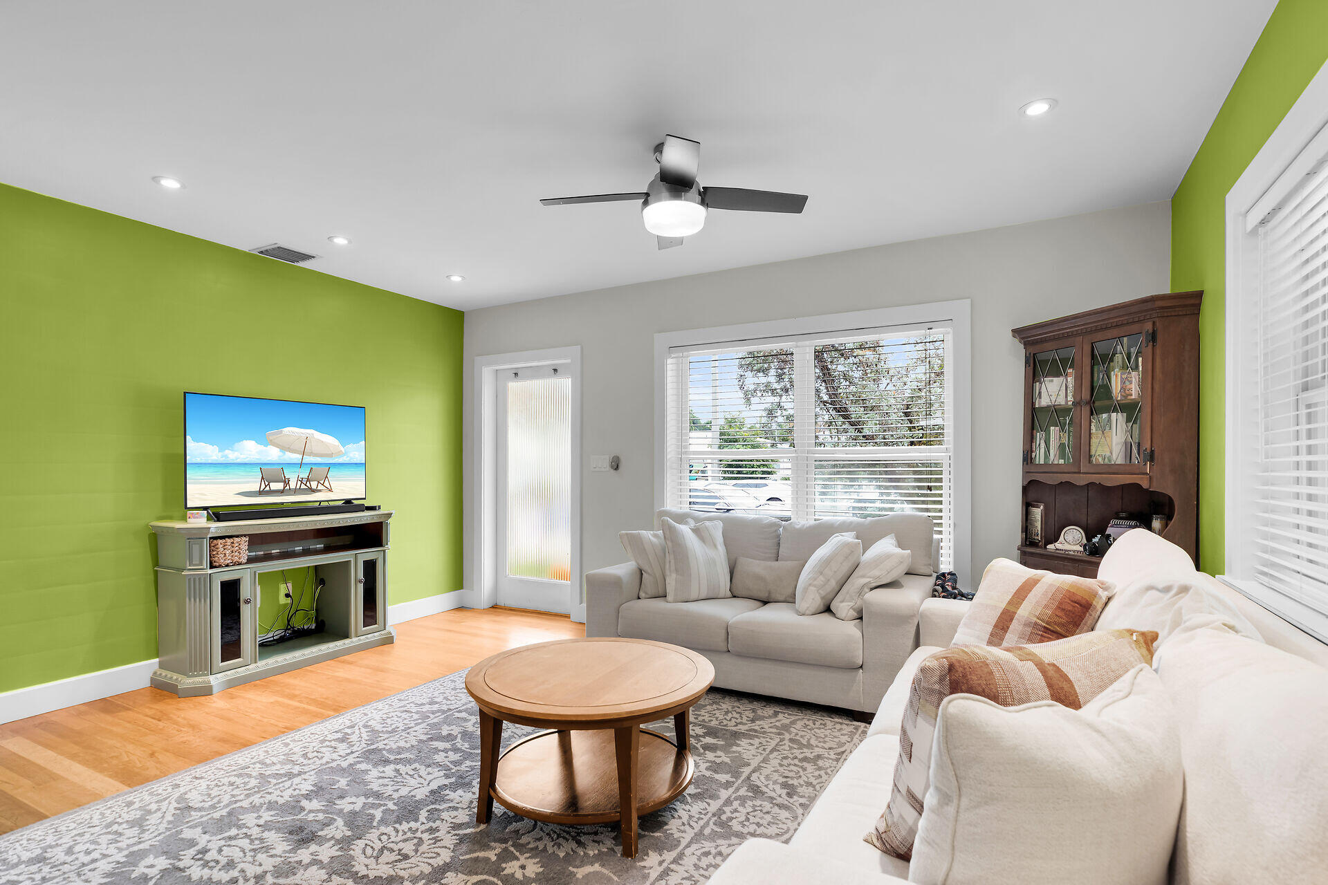 3707 Paula Avenue Key West, FL 33040 - Photo 7 of 26 a living room with furniture a fireplace and a flat screen tv