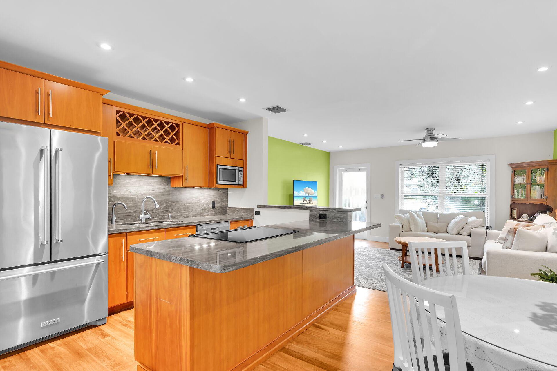 3707 Paula Avenue Key West, FL 33040 - Photo 9 of 26 a kitchen with stainless steel appliances granite countertop a sink a refrigerator and a stove