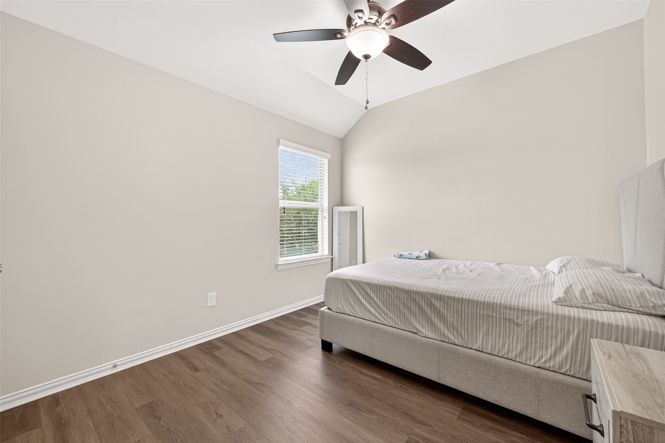 8 Landscape Court Conroe, TX 77301 - Photo 37 of 43 a bedroom with a bed and a window