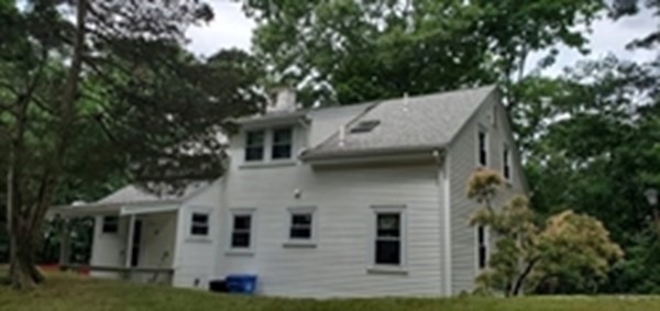 a view of house with yard