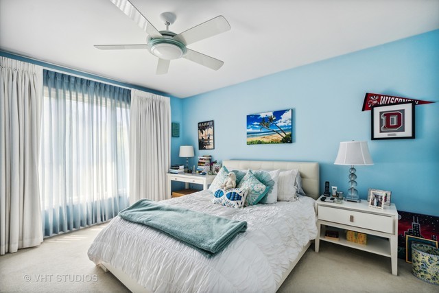 108 Riverside Drive Deerfield, IL 60015 - Photo 11 of 22 a bedroom with bed and a chandelier