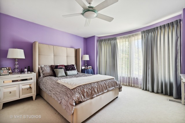 108 Riverside Drive Deerfield, IL 60015 - Photo 13 of 22 a bedroom with a bed and a chandelier
