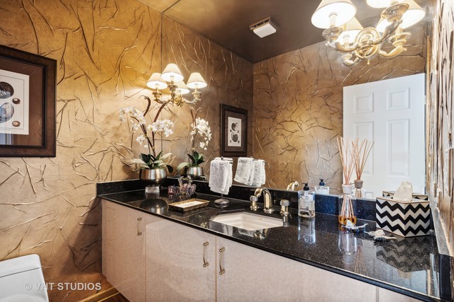 108 Riverside Drive Deerfield, IL 60015 - Photo 16 of 22 a bathroom with a sink and a mirror