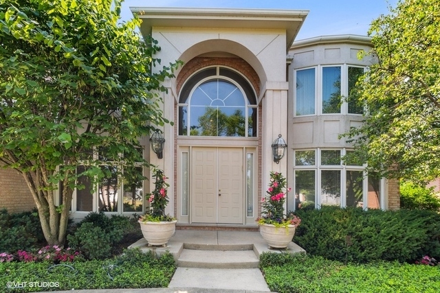 108 Riverside Drive Deerfield, IL 60015 - Photo 2 of 22 a front view of a house with a garden
