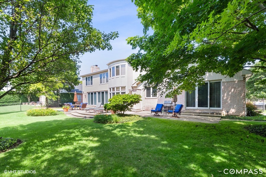 108 Riverside Drive Deerfield, IL 60015 - Photo 4 of 22 front view of a house with a yard porch and sitting area