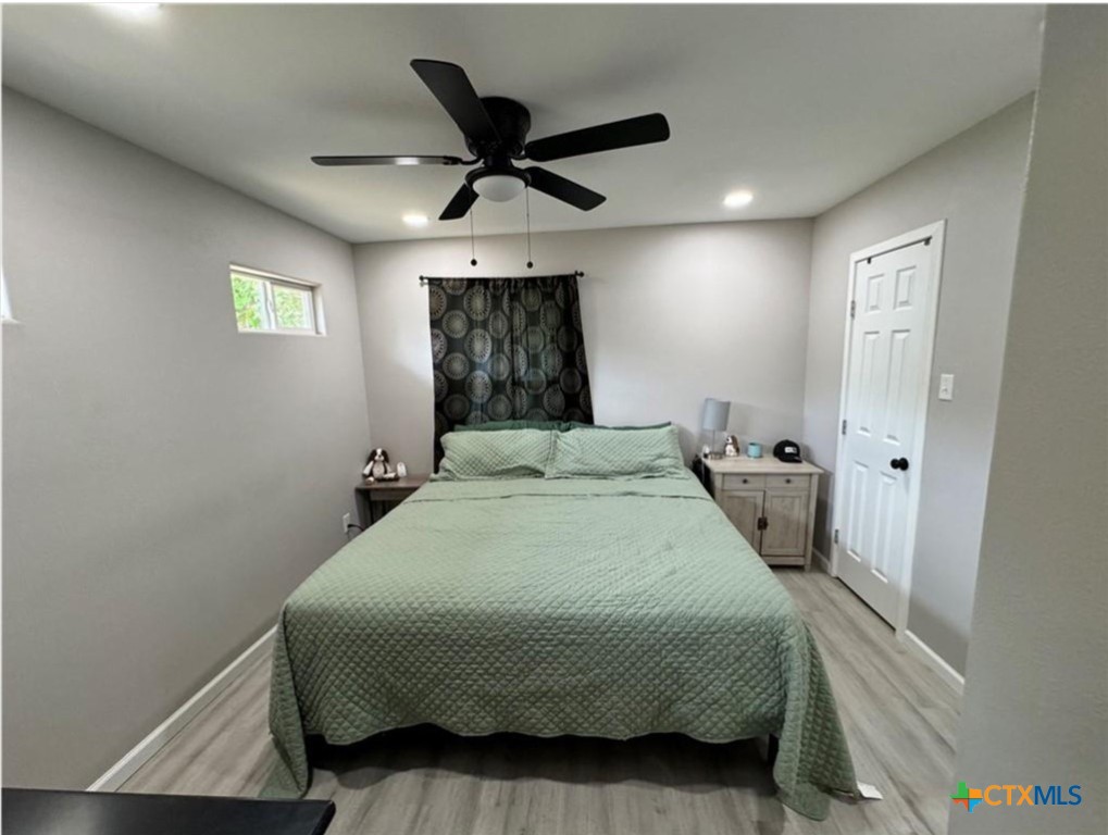 2409 Mitchell Avenue Waco, TX 76708 - Photo 11 of 17 a bedroom with a bed and a ceiling fan