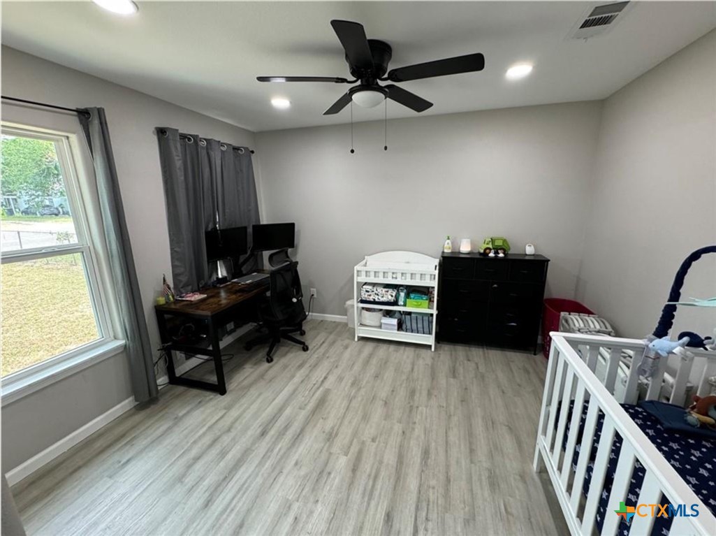 2409 Mitchell Avenue Waco, TX 76708 - Photo 14 of 17 a view of a workspace with furniture and a window