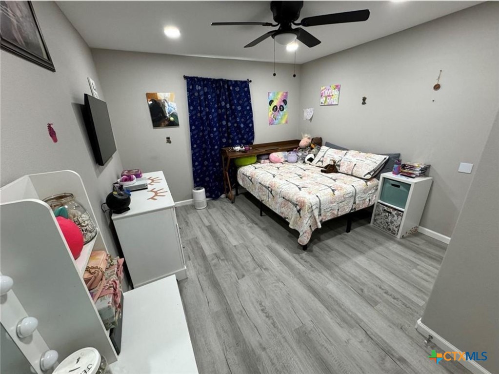 2409 Mitchell Avenue Waco, TX 76708 - Photo 15 of 17 a living room with furniture and a flat screen tv