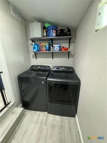 a kitchen with a stove and cabinets