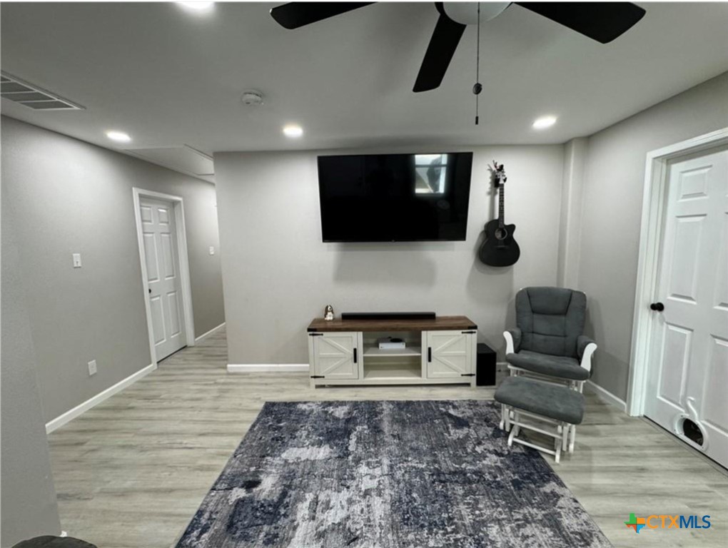 2409 Mitchell Avenue Waco, TX 76708 - Photo 6 of 17 a living room with furniture and a flat screen tv