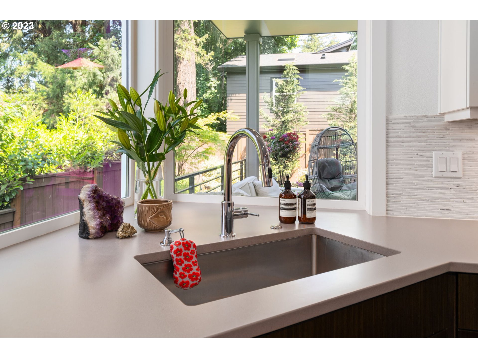 7660 Southwest 36th Avenue Portland, OR 97219 - Photo 12 of 40 a bathroom with a sink mirror and vanity