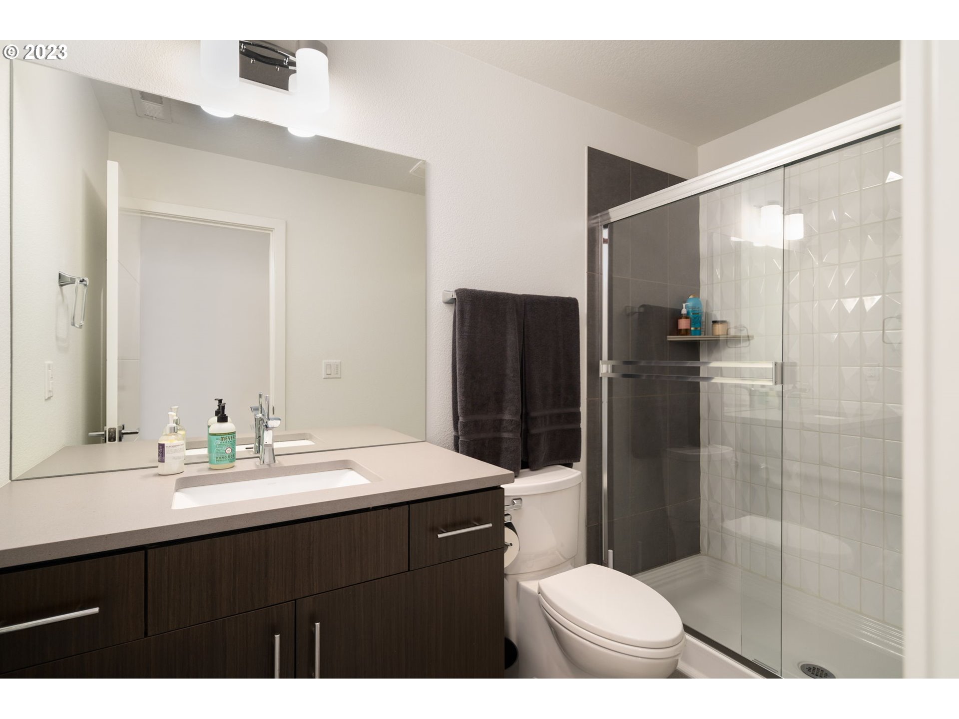7660 Southwest 36th Avenue Portland, OR 97219 - Photo 22 of 40 a bathroom with a sink shower and a toilet
