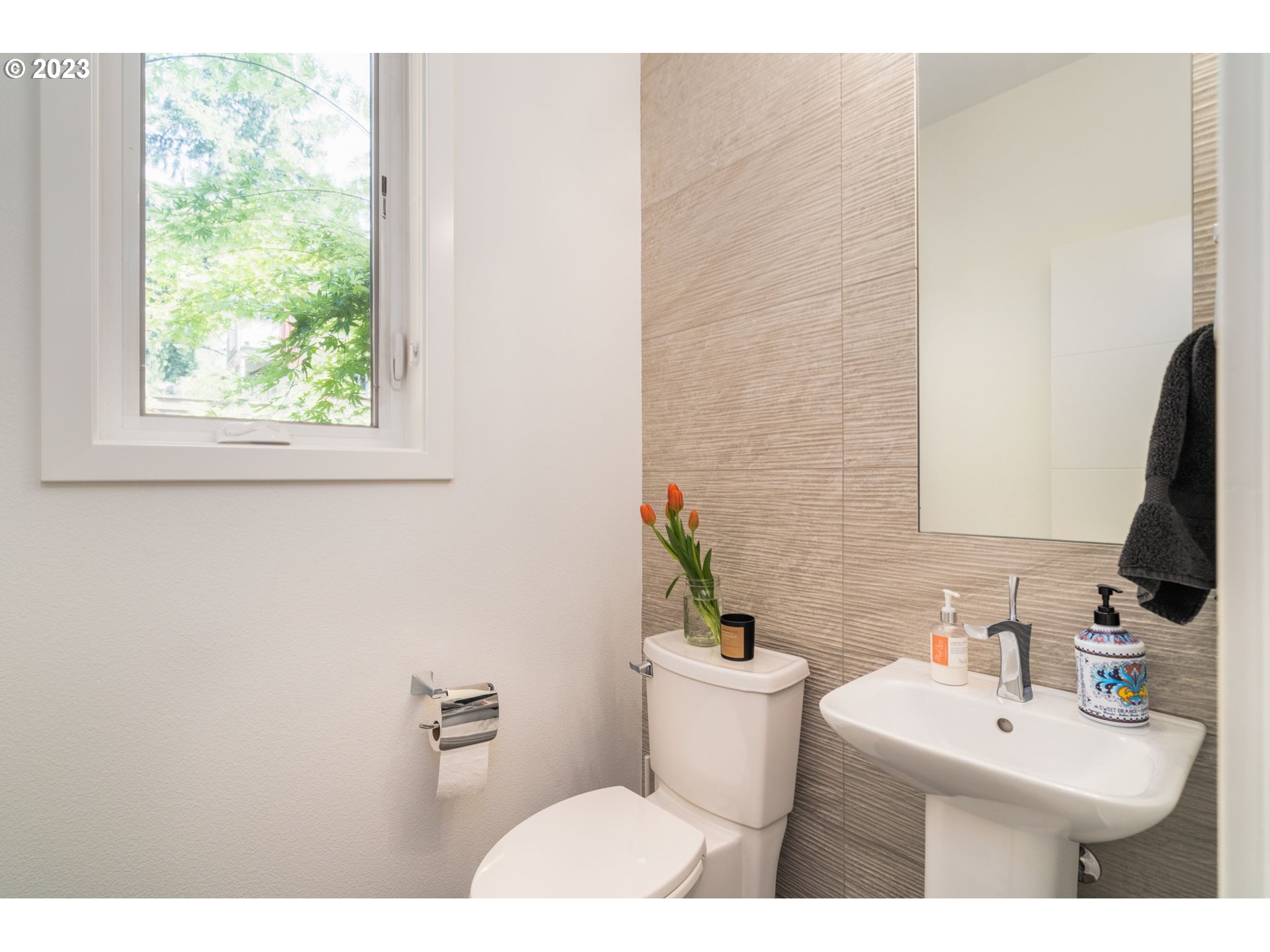 7660 Southwest 36th Avenue Portland, OR 97219 - Photo 24 of 40 a bathroom with a sink toilet and mirror