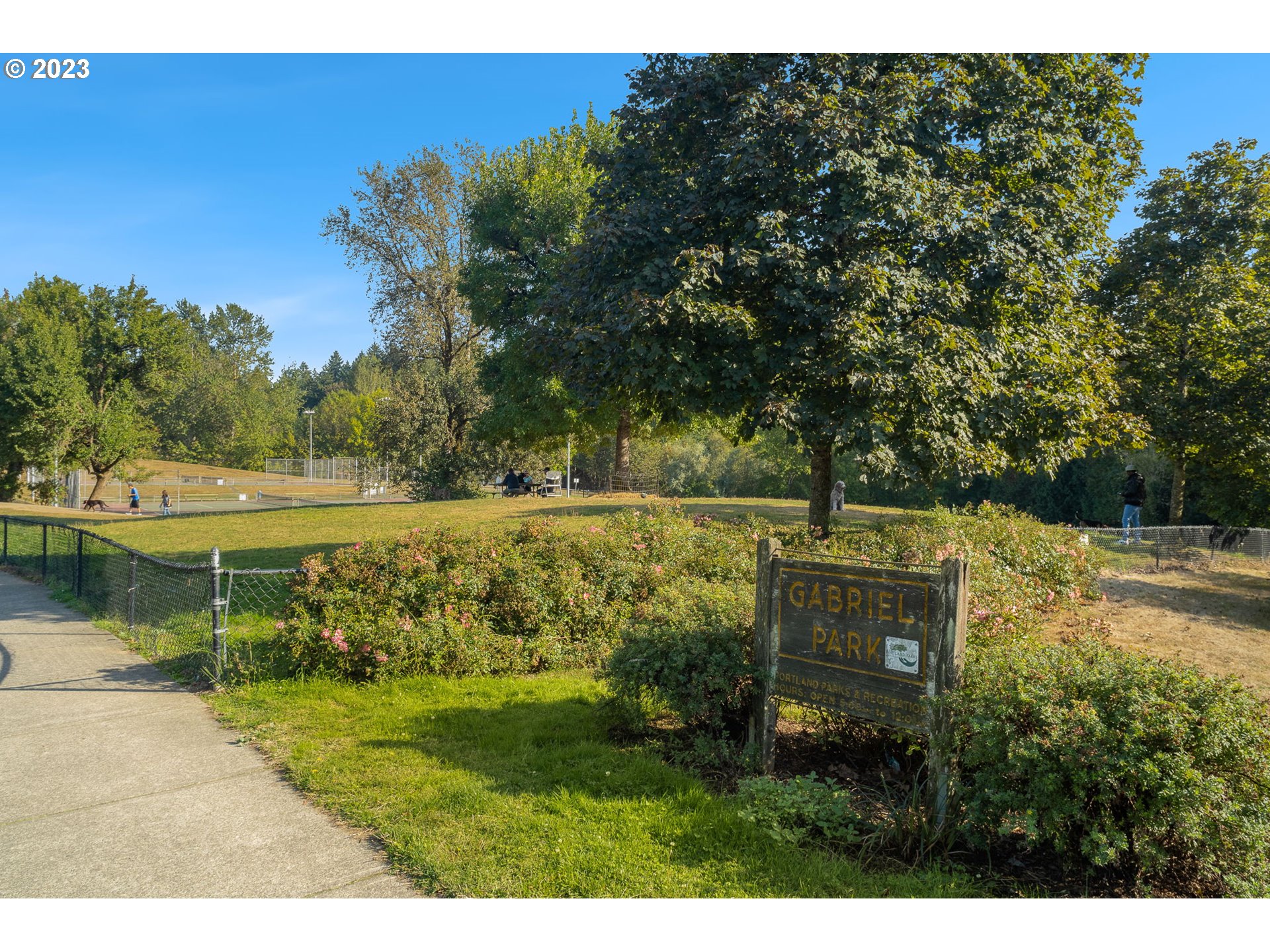 7660 Southwest 36th Avenue Portland, OR 97219 - Photo 32 of 40 a view of a lake with a yard