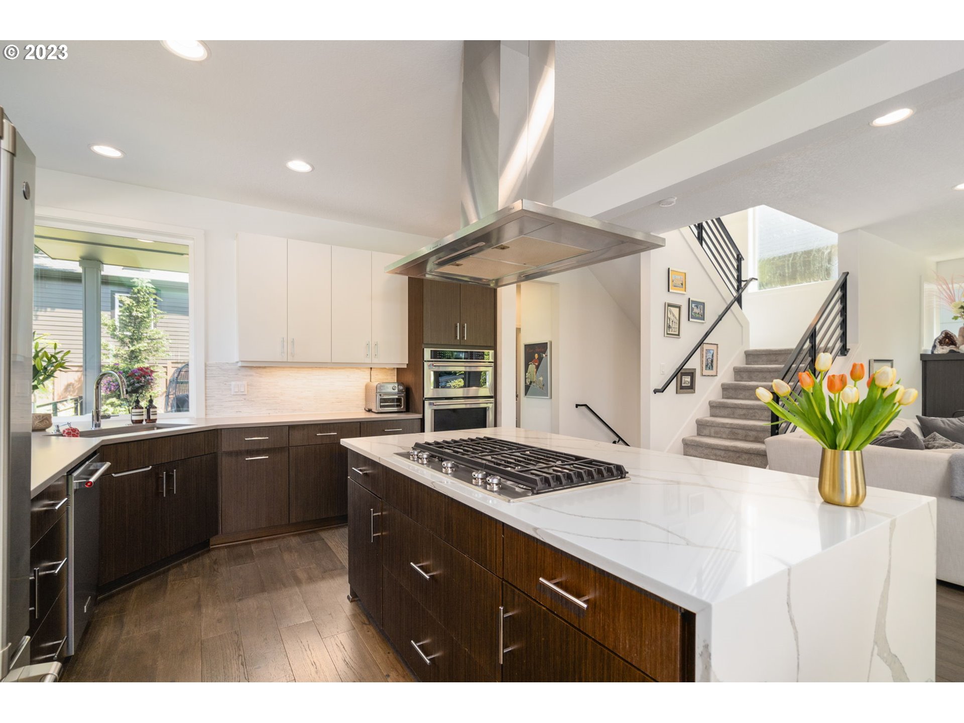 7660 Southwest 36th Avenue Portland, OR 97219 - Photo 9 of 40 a kitchen with a sink a counter appliances and cabinets