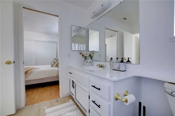 a en suite bathroom with a sink and mirror