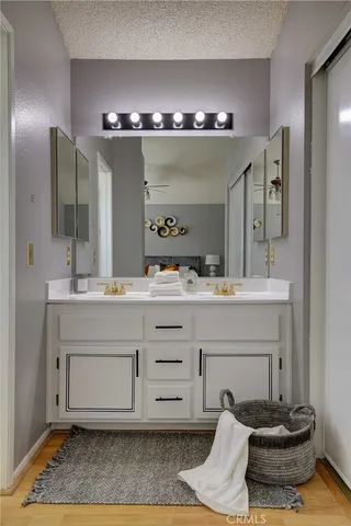 a bathroom with a double vanity sink and a mirror