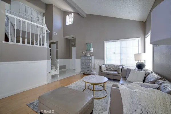a living room with furniture and a table