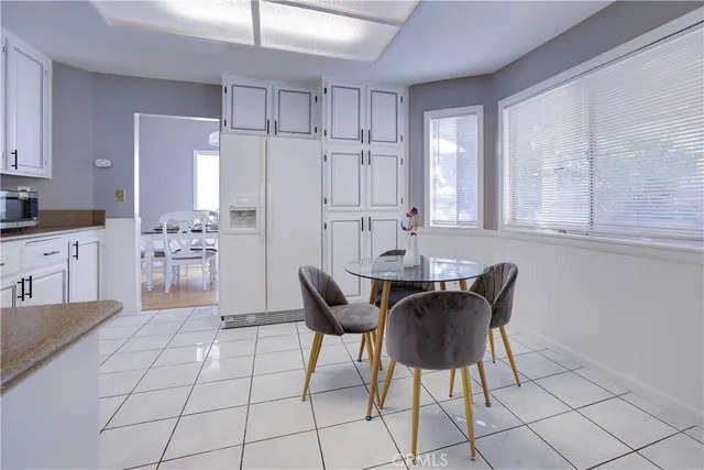 a view of a dining room with furniture and chandelier