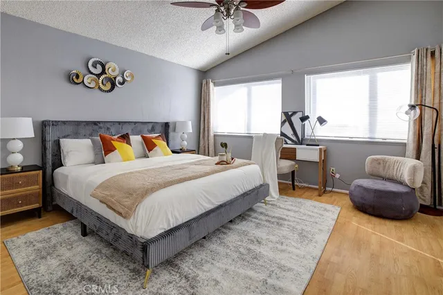 a bedroom with a bed and a couch