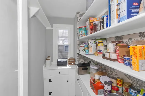 a room with a table and chairs