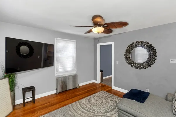a living room with furniture and a rug